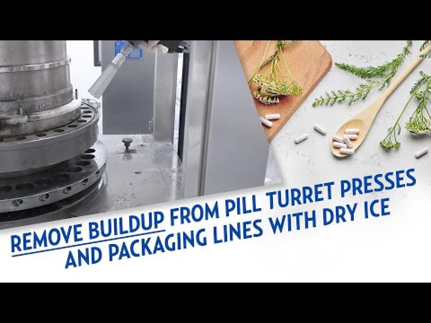 A machine is being cleaned with dry ice, and a wooden cutting board with herbs, a wooden spoon, and white capsules are shown. Text reads: Remove buildup from pill turret presses and packaging lines with dry ice.