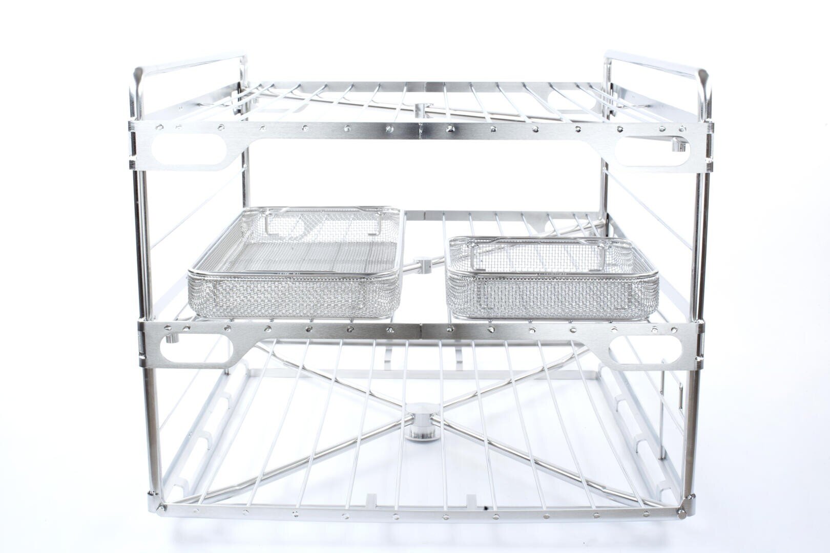 A two-tiered metal rack with wire shelves, holding two rectangular mesh baskets on the middle shelf, all placed against a white background.