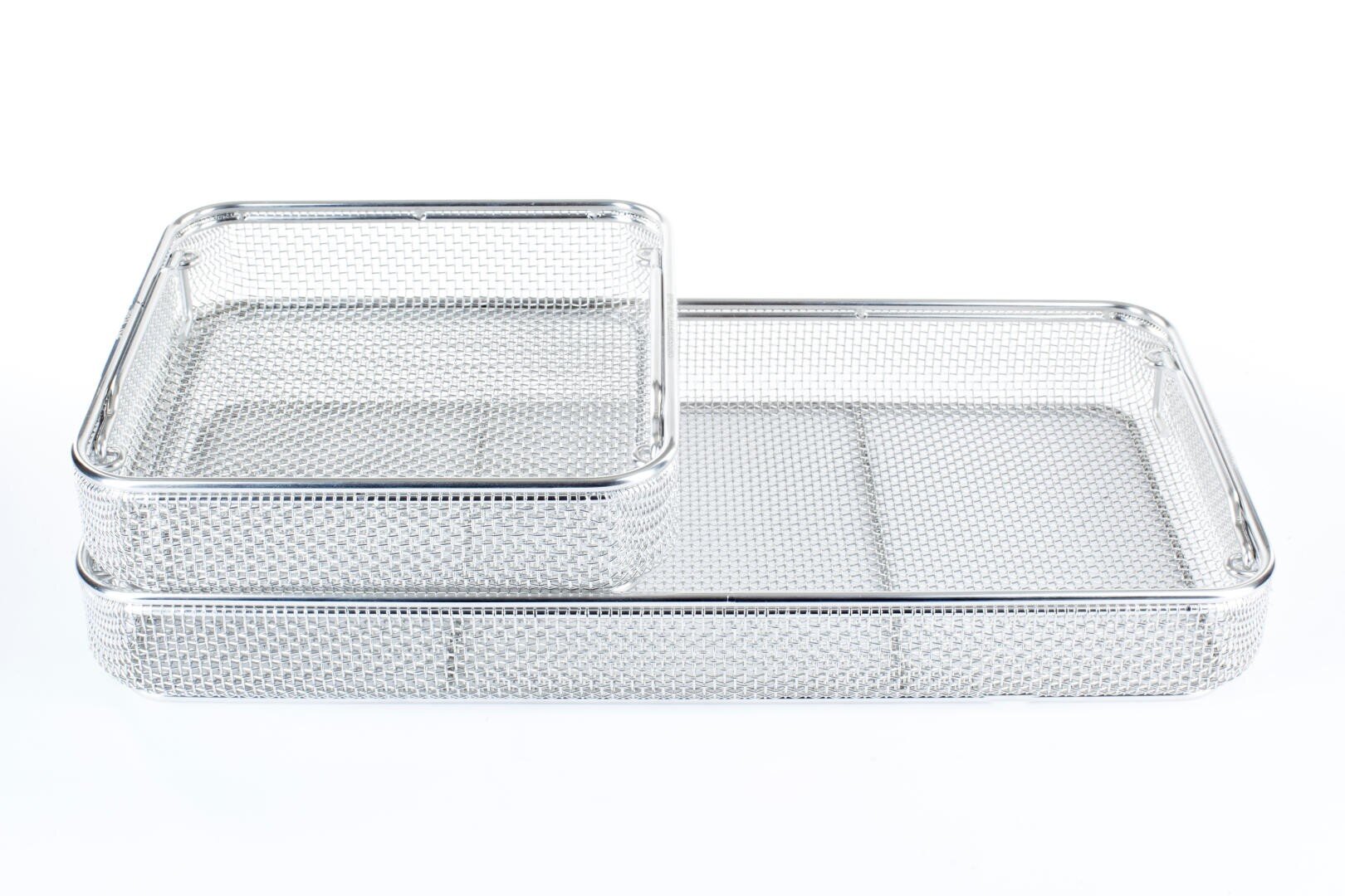 Two rectangular trays made of silver wire mesh, one slightly stacked on top of the other, on a white background.