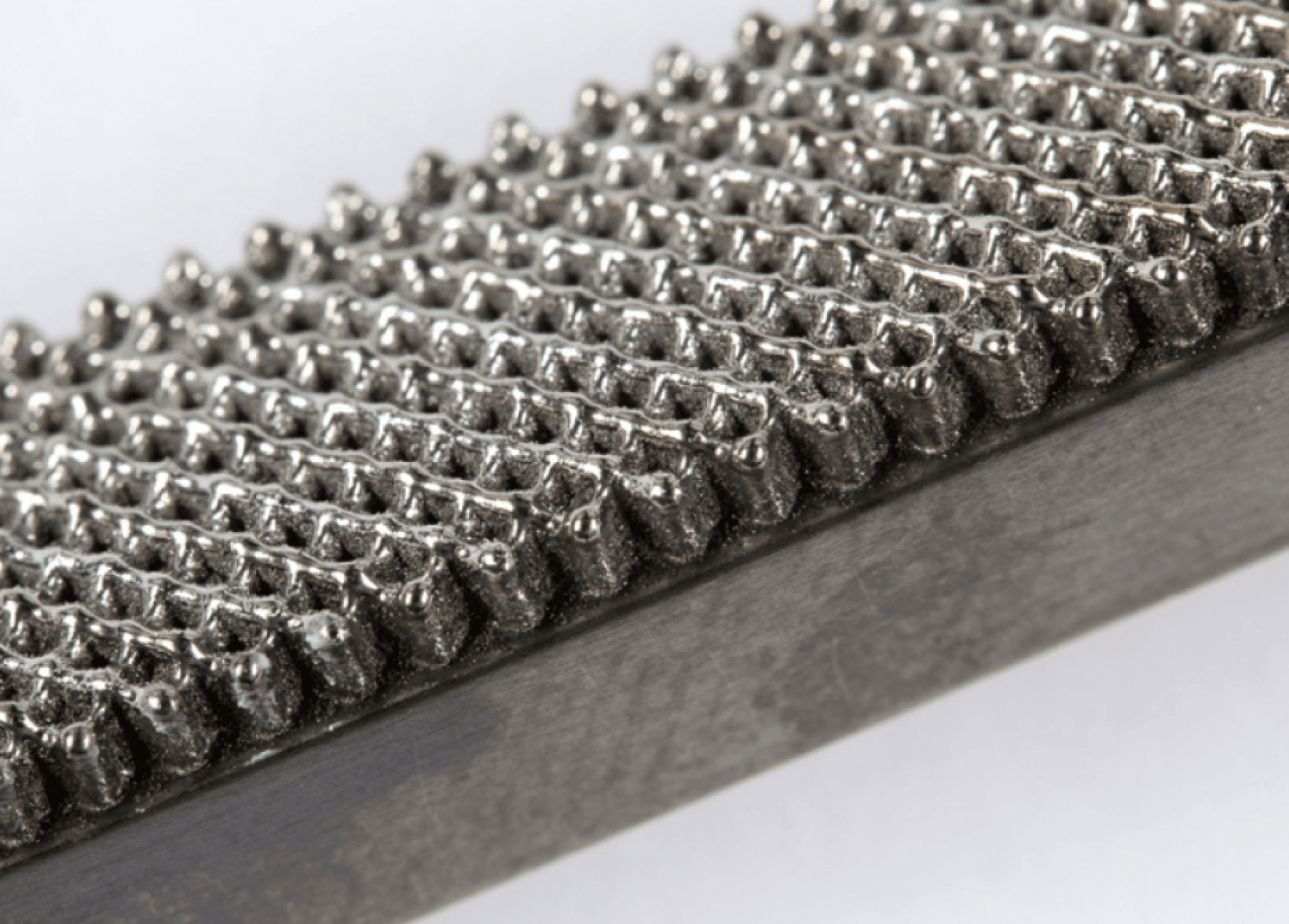 Section of a composite sample from bulk and AM structure for fatigue testing (bending test).