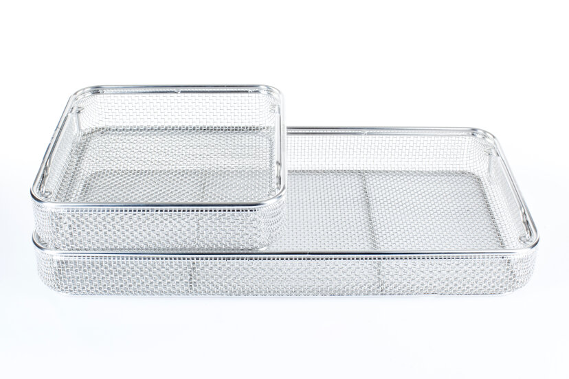 Two rectangular, silver metal mesh trays are stacked together, with the smaller tray placed partially inside the larger one, both on a white background.